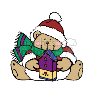 The image is a clipart of a teddy bear wearing a Santa hat and a green scarf with red stripes. The bear is holding a colorful birdhouse adorned with a heart design. The bear is sitting and appears to be very content and peaceful. The overall theme of the image is festive, highlighting elements associated with Christmas or the holiday season.