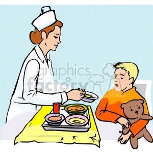 A nurse feeding a little boy in the hospital