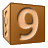 This animated GIF is a brown children's building block spinning, with the number 9 on it