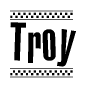 The image contains the text Troy in a bold, stylized font, with a checkered flag pattern bordering the top and bottom of the text.