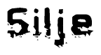 This nametag says Silje, and has a static looking effect at the bottom of the words. The words are in a stylized font.