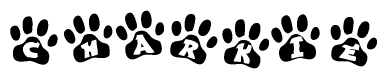 The image shows a series of animal paw prints arranged horizontally. Within each paw print, there's a letter; together they spell Charkie