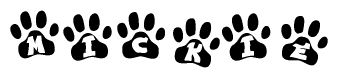 The image shows a series of animal paw prints arranged in a horizontal line. Each paw print contains a letter, and together they spell out the word Mickie.