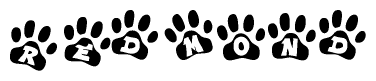 The image shows a row of animal paw prints, each containing a letter. The letters spell out the word Redmond within the paw prints.