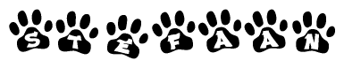 The image shows a series of animal paw prints arranged in a horizontal line. Each paw print contains a letter, and together they spell out the word Stefaan.