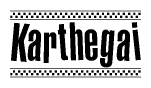 The image contains the text Karthegai in a bold, stylized font, with a checkered flag pattern bordering the top and bottom of the text.