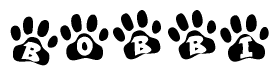 The image shows a series of animal paw prints arranged in a horizontal line. Each paw print contains a letter, and together they spell out the word Bobbi.