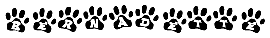 The image shows a row of animal paw prints, each containing a letter. The letters spell out the word Bernadette within the paw prints.