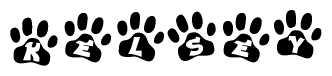 The image shows a series of animal paw prints arranged in a horizontal line. Each paw print contains a letter, and together they spell out the word Kelsey.