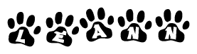 The image shows a series of animal paw prints arranged horizontally. Within each paw print, there's a letter; together they spell Leann