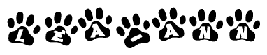 The image shows a series of animal paw prints arranged in a horizontal line. Each paw print contains a letter, and together they spell out the word Lea-ann.