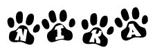 The image shows a series of animal paw prints arranged in a horizontal line. Each paw print contains a letter, and together they spell out the word Nika.