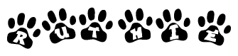 The image shows a series of animal paw prints arranged in a horizontal line. Each paw print contains a letter, and together they spell out the word Ruthie.