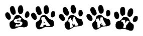 The image shows a row of animal paw prints, each containing a letter. The letters spell out the word Sammy within the paw prints.