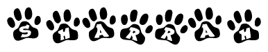 The image shows a series of animal paw prints arranged horizontally. Within each paw print, there's a letter; together they spell Sharrah