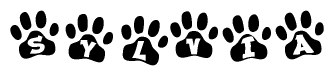 The image shows a row of animal paw prints, each containing a letter. The letters spell out the word Sylvia within the paw prints.