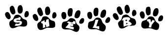 The image shows a row of animal paw prints, each containing a letter. The letters spell out the word Shelby within the paw prints.