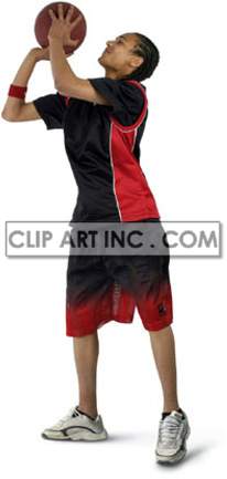 A young basketball player wearing a black and red sports outfit is seen about to catch a basketball.