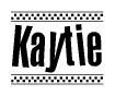 The image contains the text Kaytie in a bold, stylized font, with a checkered flag pattern bordering the top and bottom of the text.
