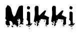 This nametag says Mikki, and has a static looking effect at the bottom of the words. The words are in a stylized font.