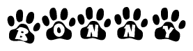 The image shows a row of animal paw prints, each containing a letter. The letters spell out the word Bonny within the paw prints.