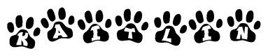The image shows a row of animal paw prints, each containing a letter. The letters spell out the word Kaitlin within the paw prints.
