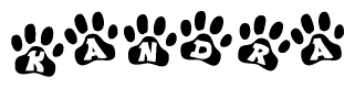 The image shows a series of animal paw prints arranged horizontally. Within each paw print, there's a letter; together they spell Kandra