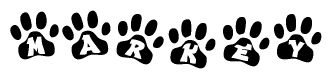 The image shows a series of animal paw prints arranged horizontally. Within each paw print, there's a letter; together they spell Markey