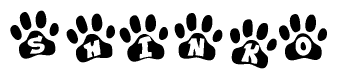 The image shows a series of animal paw prints arranged in a horizontal line. Each paw print contains a letter, and together they spell out the word Shinko.