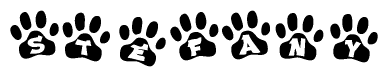 The image shows a series of animal paw prints arranged in a horizontal line. Each paw print contains a letter, and together they spell out the word Stefany.