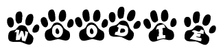 The image shows a series of animal paw prints arranged horizontally. Within each paw print, there's a letter; together they spell Woodie