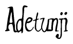 The image contains the word 'Adetunji' written in a cursive, stylized font.