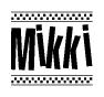 The clipart image displays the text Mikki in a bold, stylized font. It is enclosed in a rectangular border with a checkerboard pattern running below and above the text, similar to a finish line in racing. 