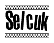 The image contains the text Selcuk in a bold, stylized font, with a checkered flag pattern bordering the top and bottom of the text.