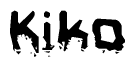 This nametag says Kiko, and has a static looking effect at the bottom of the words. The words are in a stylized font.