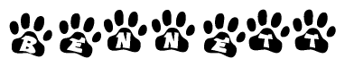 The image shows a series of animal paw prints arranged in a horizontal line. Each paw print contains a letter, and together they spell out the word Bennett.