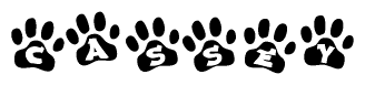 The image shows a row of animal paw prints, each containing a letter. The letters spell out the word Cassey within the paw prints.