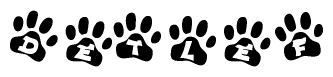 The image shows a row of animal paw prints, each containing a letter. The letters spell out the word Detlef within the paw prints.