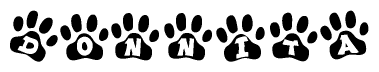 The image shows a row of animal paw prints, each containing a letter. The letters spell out the word Donnita within the paw prints.