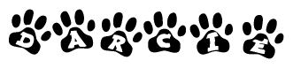 The image shows a row of animal paw prints, each containing a letter. The letters spell out the word Darcie within the paw prints.