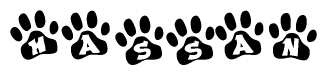The image shows a series of animal paw prints arranged in a horizontal line. Each paw print contains a letter, and together they spell out the word Hassan.