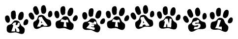 The image shows a row of animal paw prints, each containing a letter. The letters spell out the word Katetansl within the paw prints.