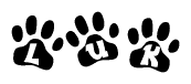 The image shows a series of animal paw prints arranged in a horizontal line. Each paw print contains a letter, and together they spell out the word Luk.