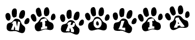 The image shows a row of animal paw prints, each containing a letter. The letters spell out the word Nikolia within the paw prints.