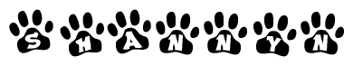 The image shows a series of animal paw prints arranged in a horizontal line. Each paw print contains a letter, and together they spell out the word Shannyn.