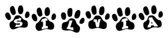 The image shows a row of animal paw prints, each containing a letter. The letters spell out the word Silvia within the paw prints.