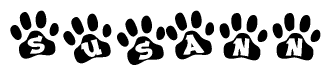 The image shows a series of animal paw prints arranged in a horizontal line. Each paw print contains a letter, and together they spell out the word Susann.