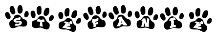 The image shows a series of animal paw prints arranged horizontally. Within each paw print, there's a letter; together they spell Stefanie