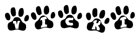 The image shows a series of animal paw prints arranged horizontally. Within each paw print, there's a letter; together they spell Vicki