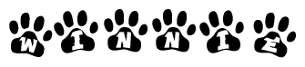 The image shows a row of animal paw prints, each containing a letter. The letters spell out the word Winnie within the paw prints.